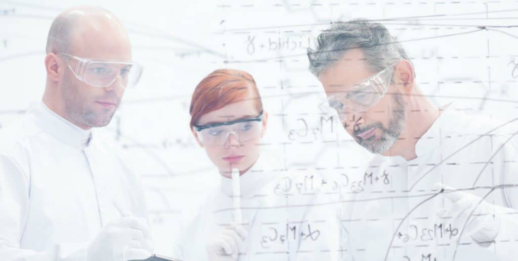 close-up of tree people in a laboratory analyzing data from a whiteboard